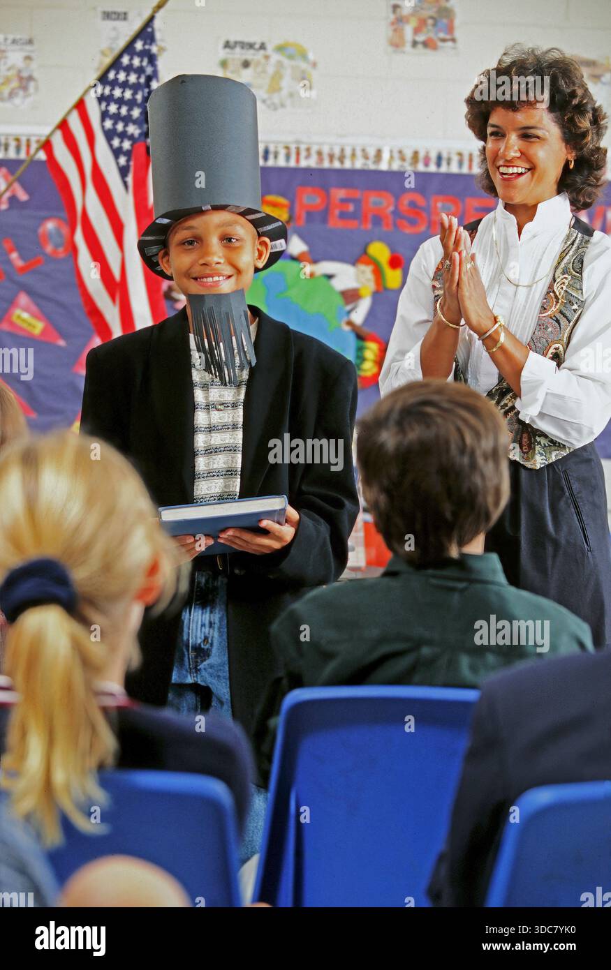 An African-American student dressed as Abraham Lincoln receipts Gettysburg address to his fellow students Stock Photo
