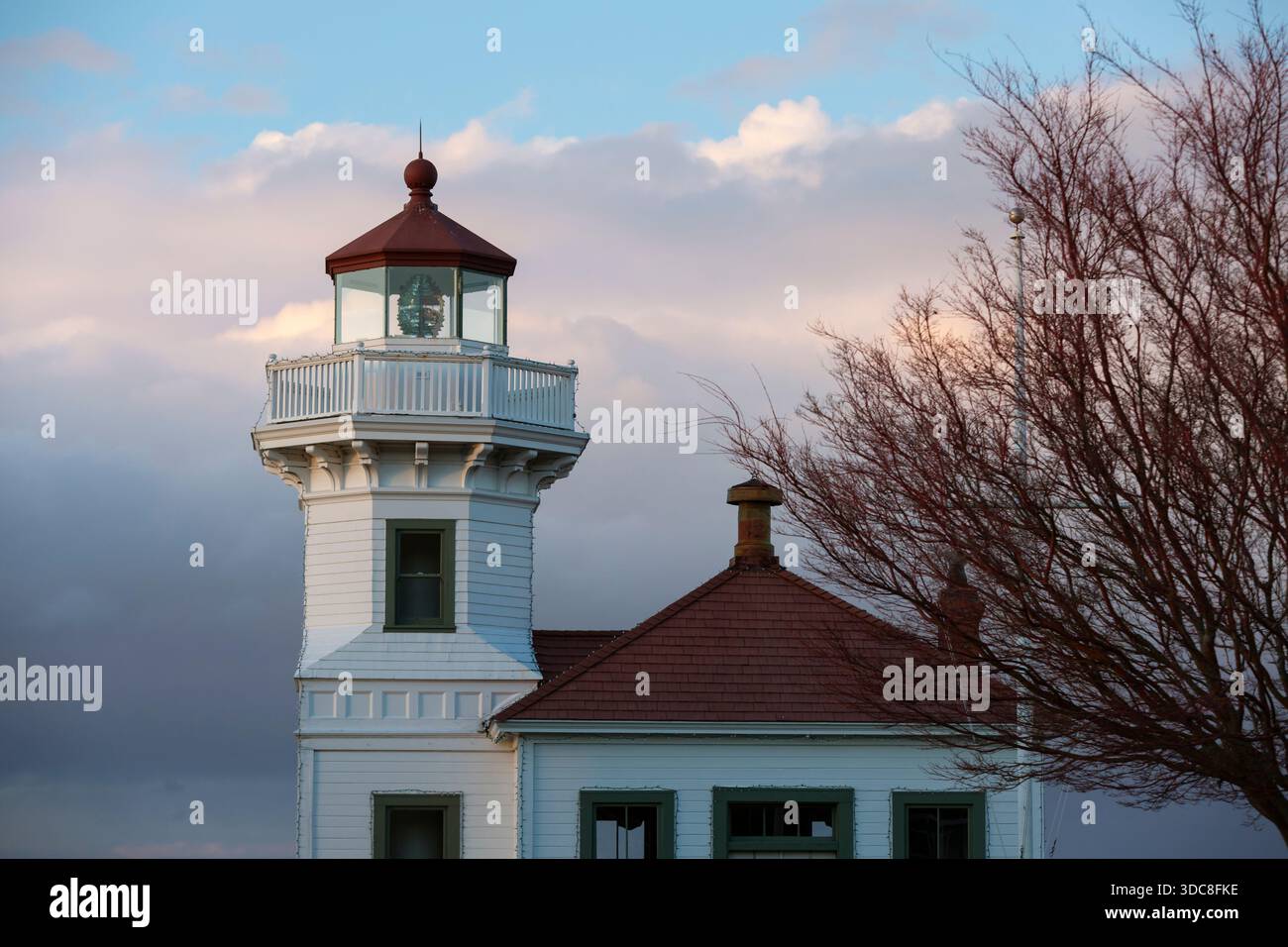 View of the historical Mukilteo Light as the sun sets in Mukilteo, Washington. Stock Photo
