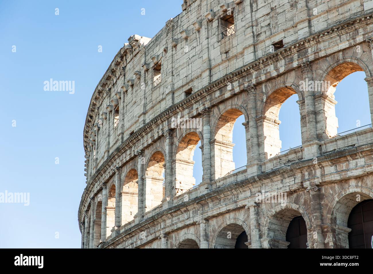 Colosseum's iconic ancient Roman amphitheater showing stone arches and ...
