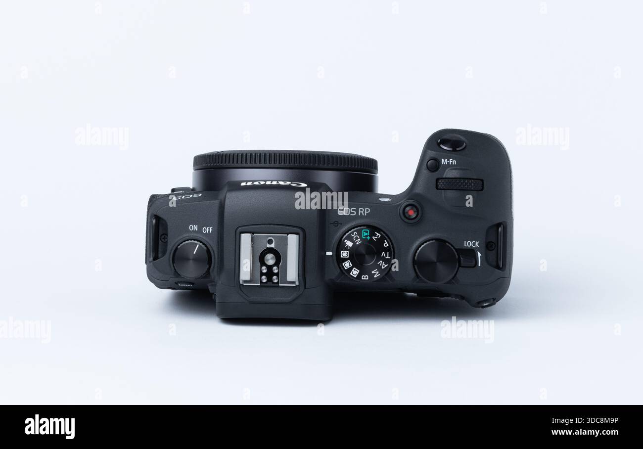 Kiew, Ukraine - December 20, 2025: Top view of a digital camera with control dials and shutter button. Photography concept. Canon camera, photo Stock Photo
