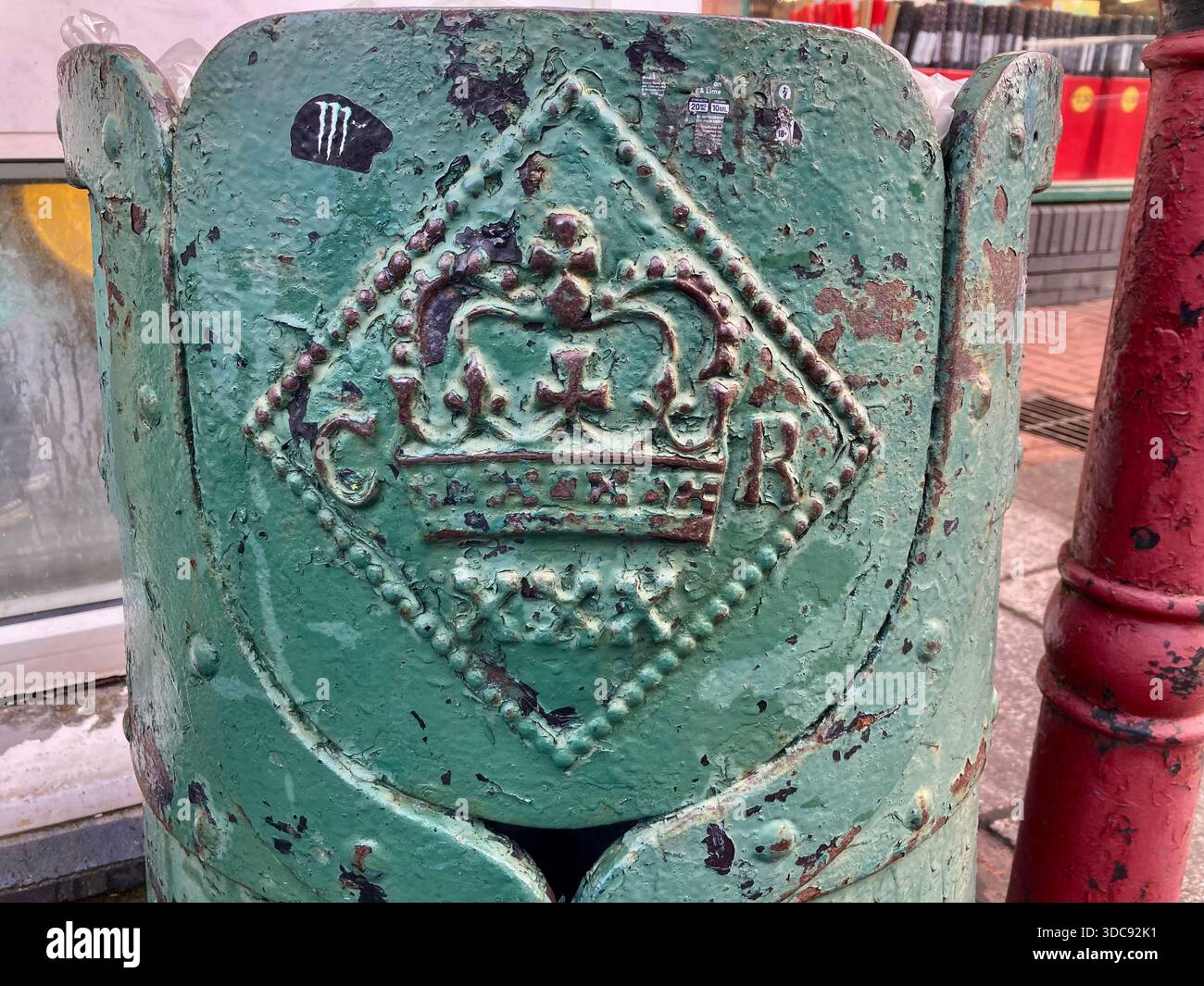 A late 19th century cast iron rubbish bin with a crowned CR (Carolus ...