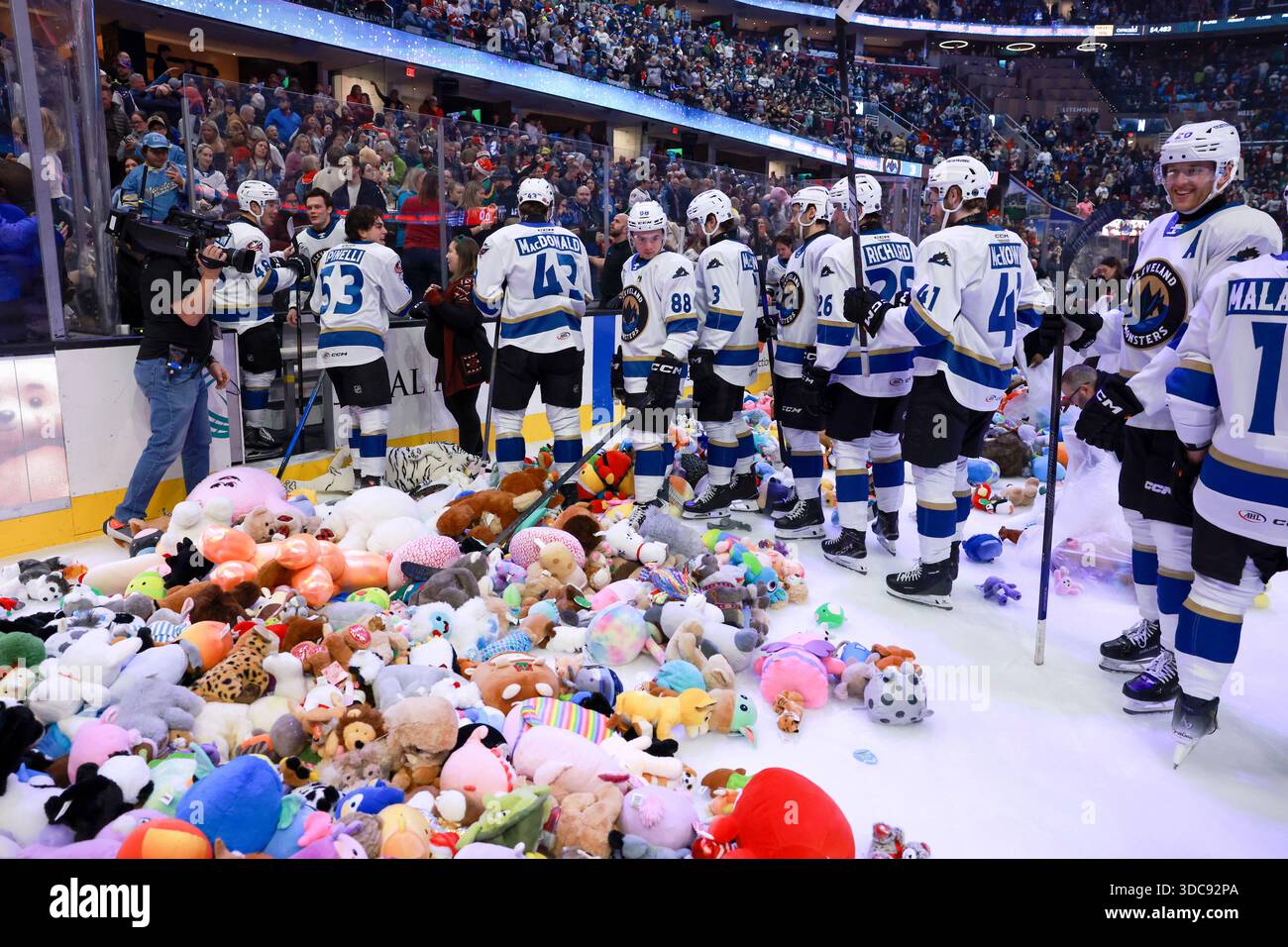 CLEVELAND, OH - DECEMBER 20: Monsters players look on as the 6,248 fans in  attendance rain down 30,164 stuffed animals onto the ice after the Monsters  scored the first goal of the