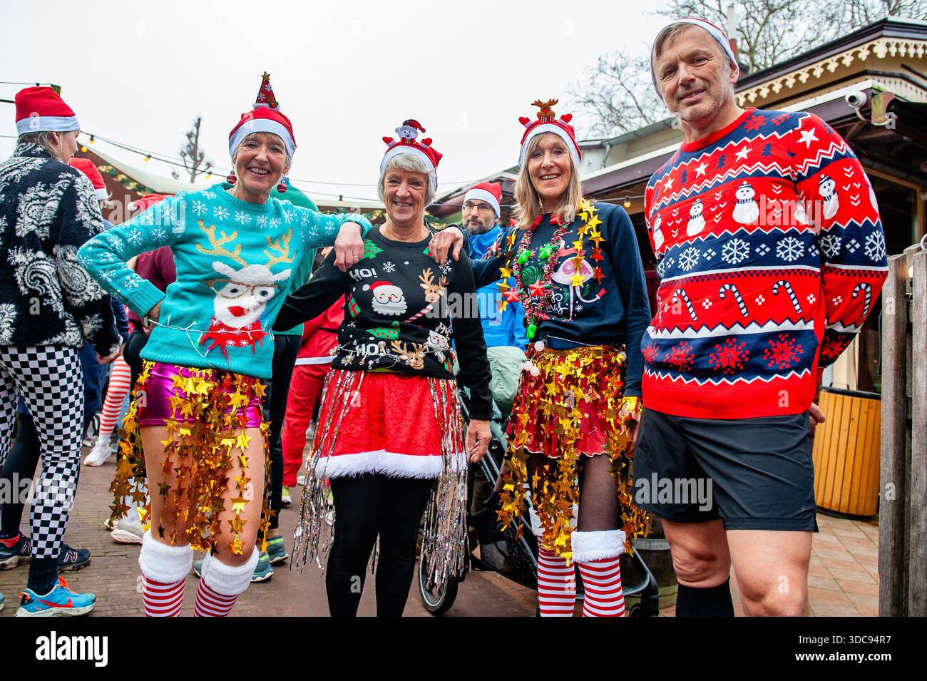 group christmas dress up Amsterdam, Netherlands. 20th Dec, 2025. A of runners with funny and colorful costumes seen posing for the media. Participants must wear their ugliest outfit to run this 5km race that Party outfit