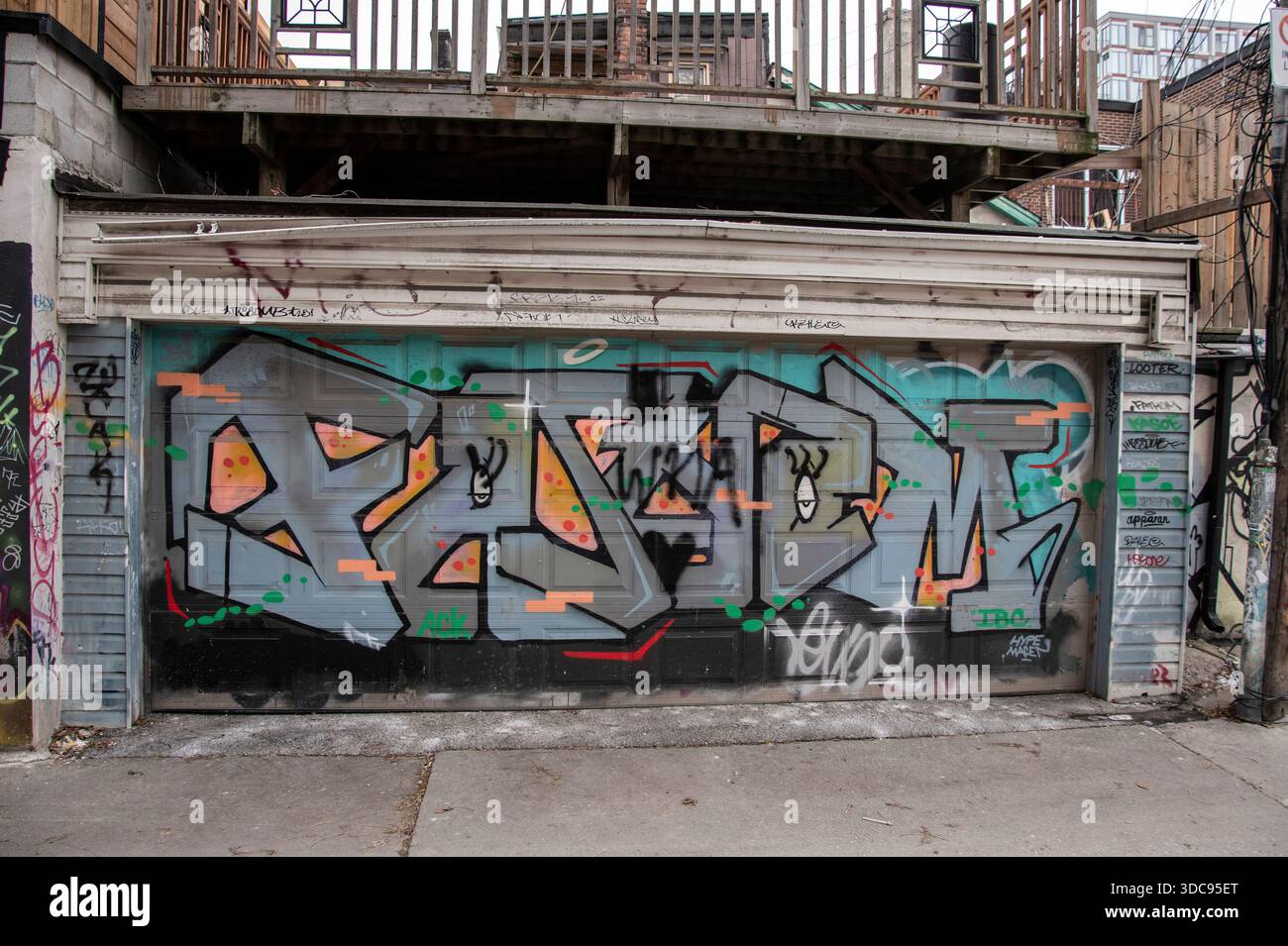 Graffiti tagged on a garage roll up door at Graffiti Alley fashion