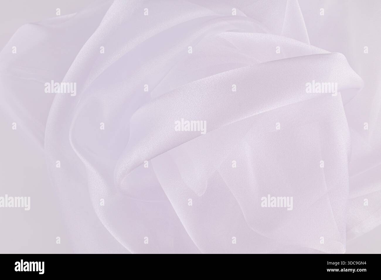 Stylish wedding background of white airy folds of transparent fabric ...