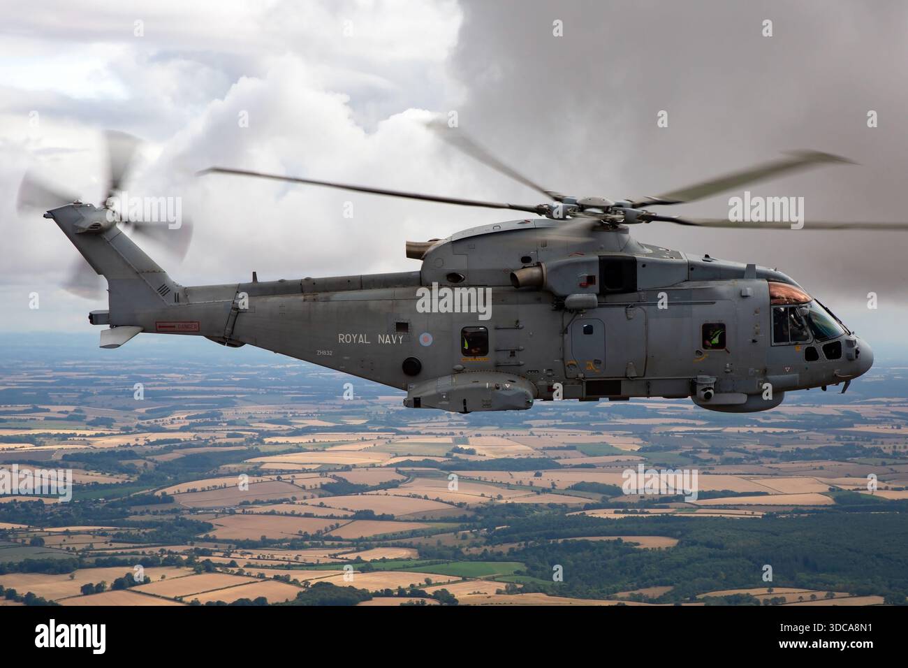 An air-to-air view of a Royal Navy EHI EH101-111 Merlin HM2 helicopter ...