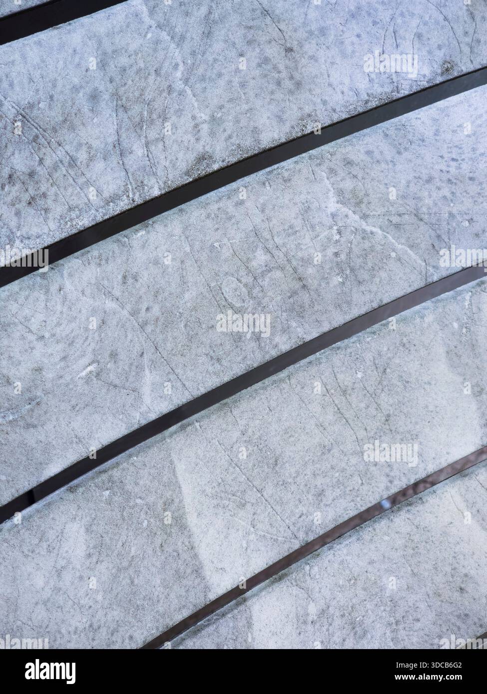Gray textured surface with parallel black lines Stock Photo