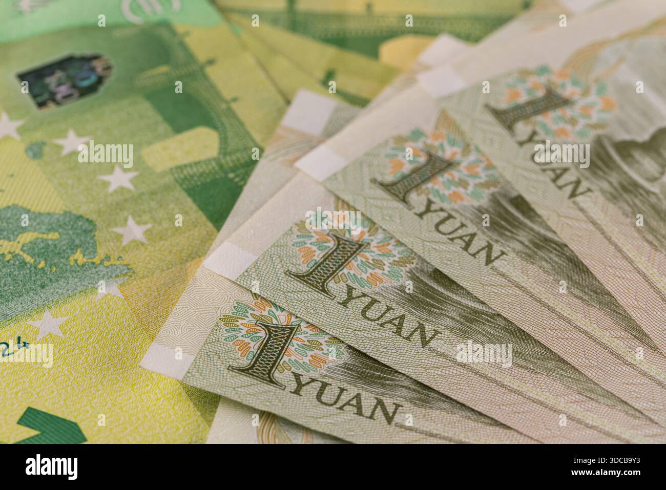 Macro of 100 Euro Banknote with Fan of Chinese One Yuan Bills Stock Photo -  Alamy