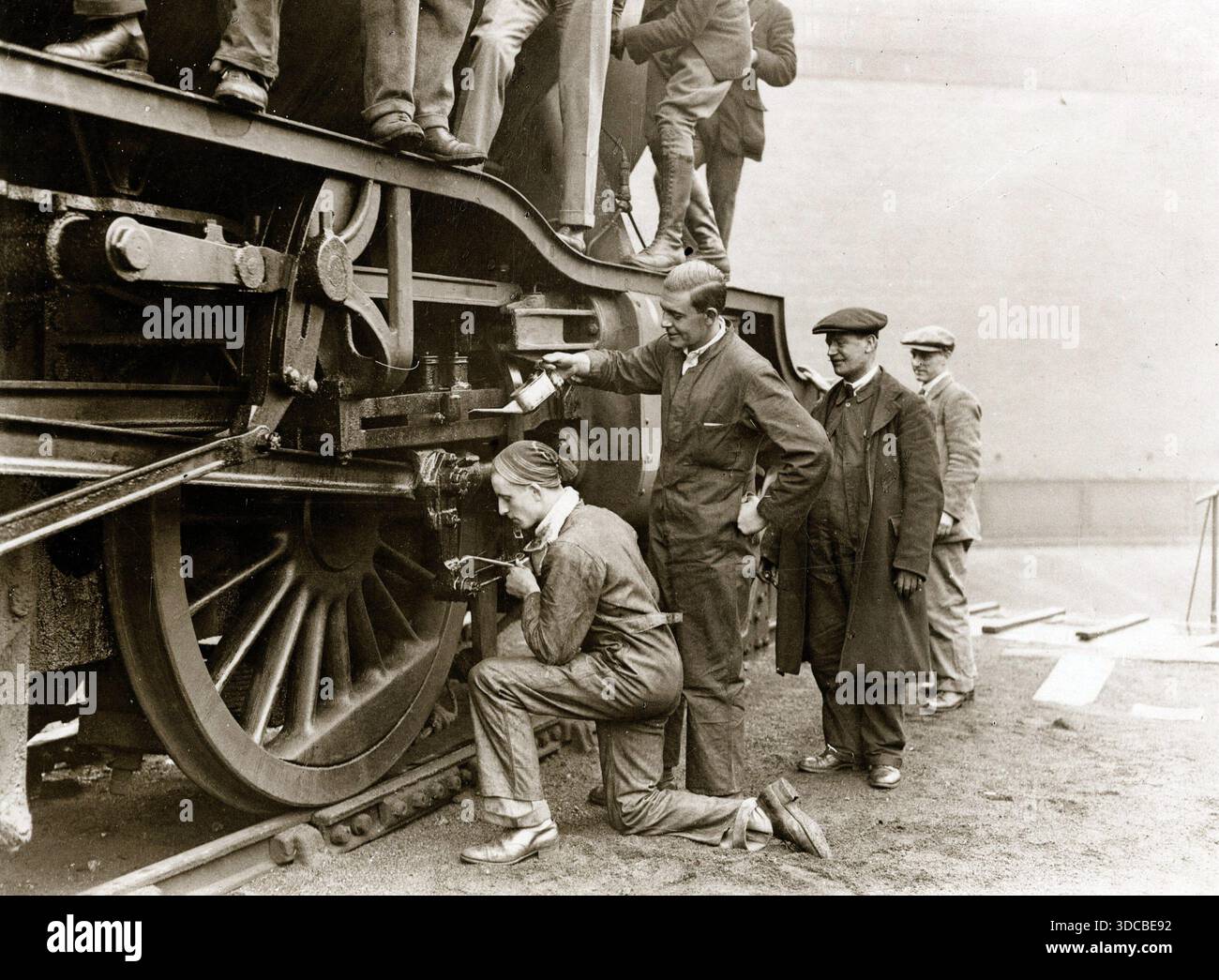 Technical student volunteering during the General Strike, lubricating a ...