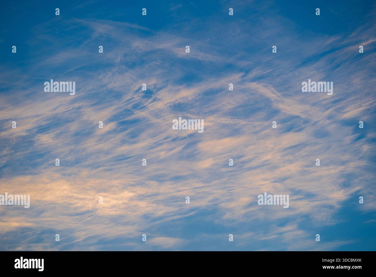 Blue sky with white clouds during sunset, texture and background Stock Photo