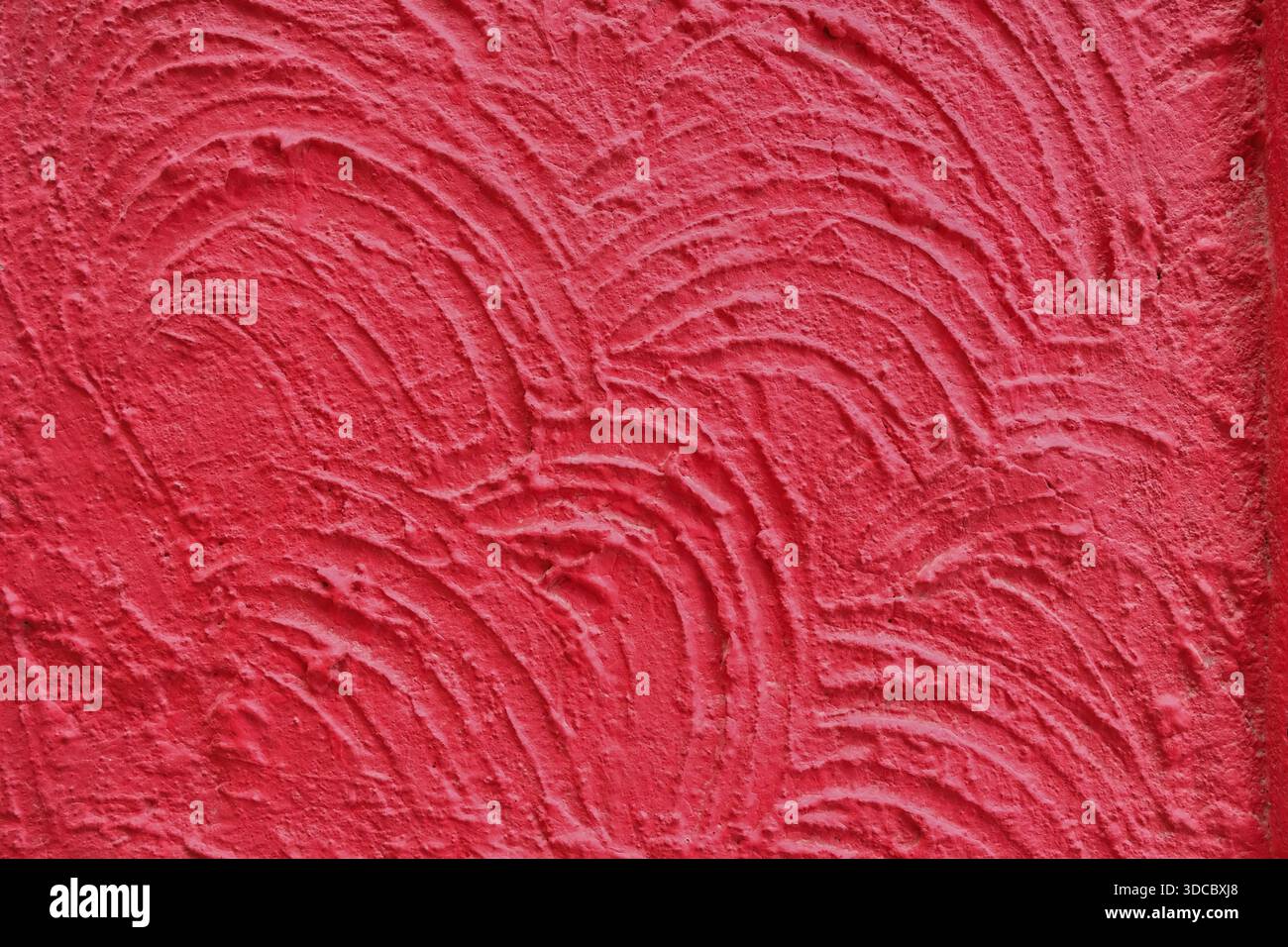 Red textured wall surface with handcrafted abstract pattern Stock Photo