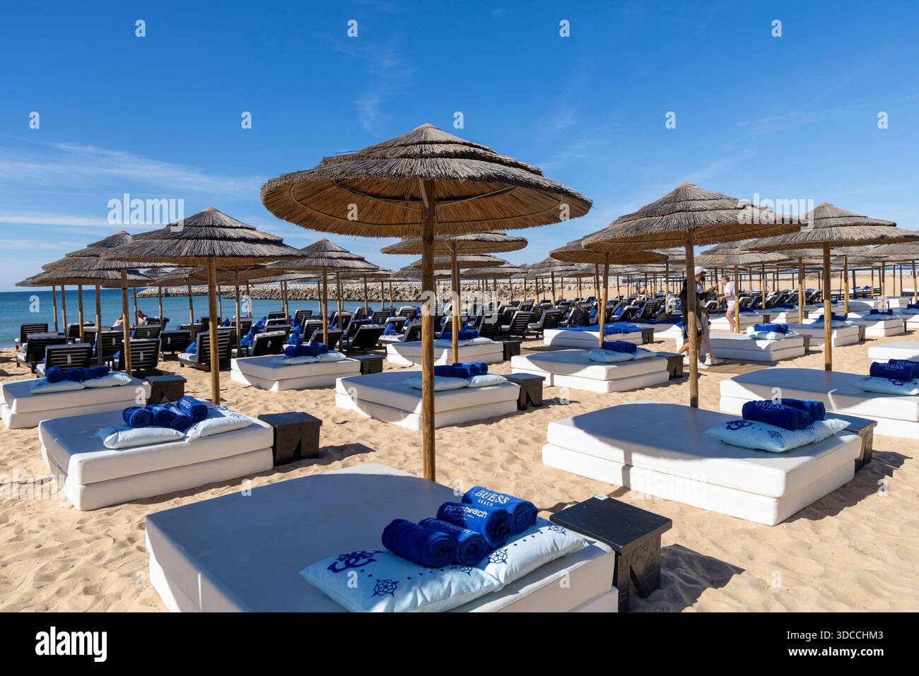 Purobeach Vilamoura, Algarve,Portugal, luxury beach resort offering relaxing sunbeds with parasols on the Algarve coast, Europe Stock Photo