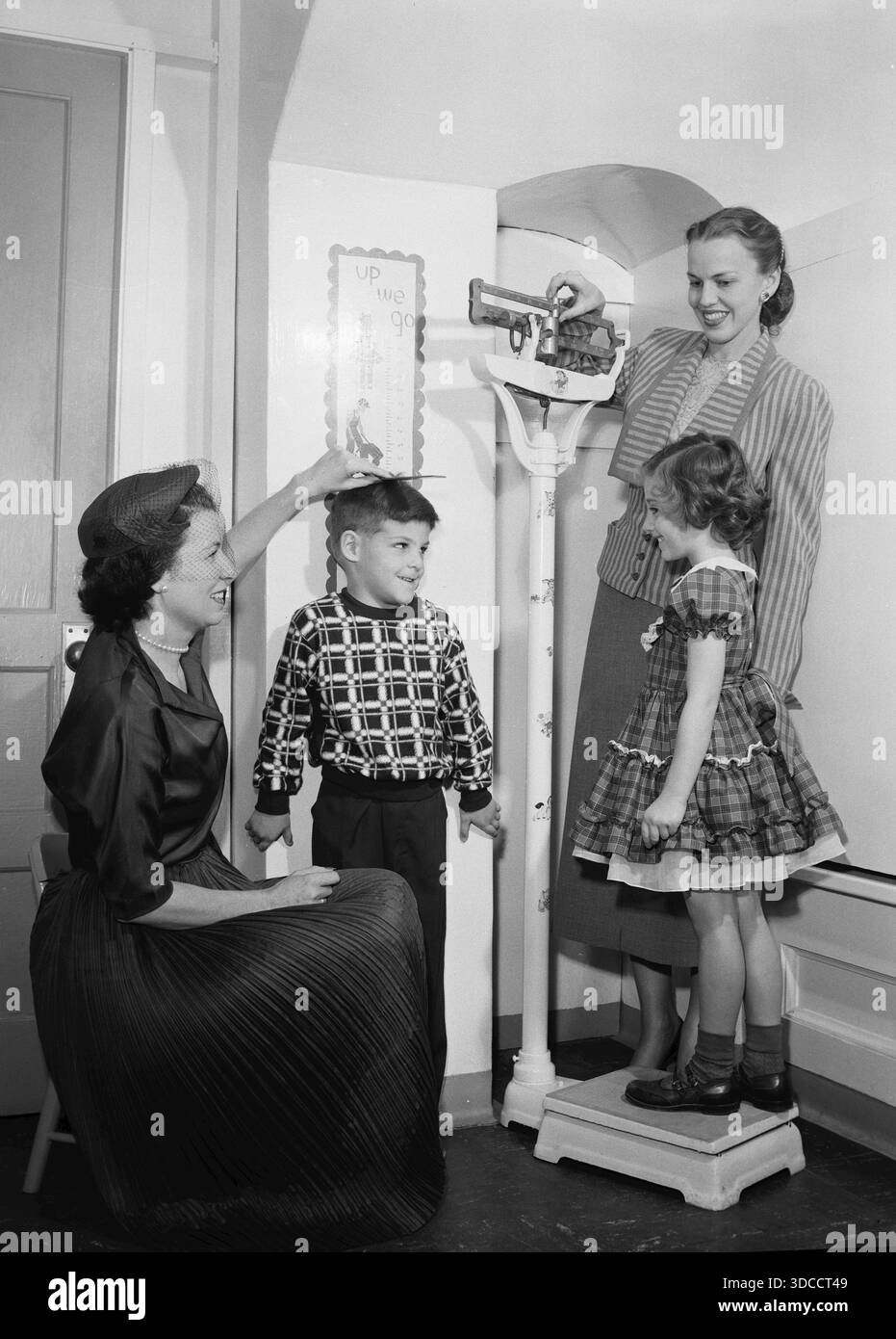 Childhood weights and height are measured in California, ca. 1955. Stock Photo