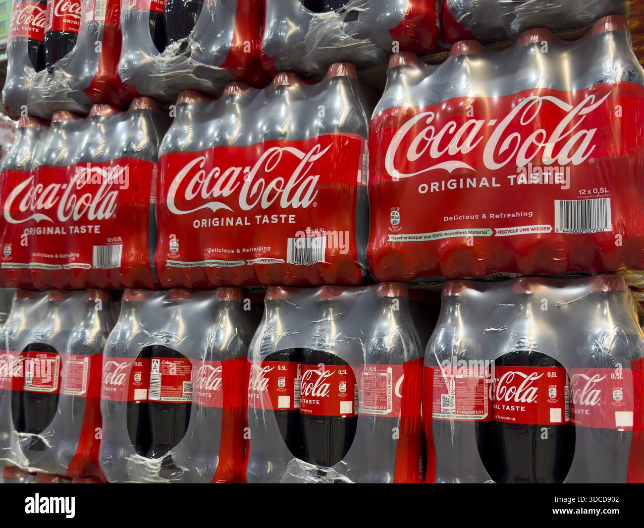 0.5 half liter plastic PET bottles stacked in plastic packs with sugary ...
