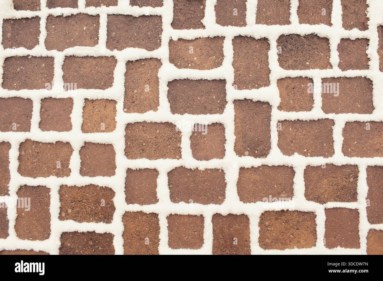 Winter snow covered pavement texture, abstract background Stock Photo
