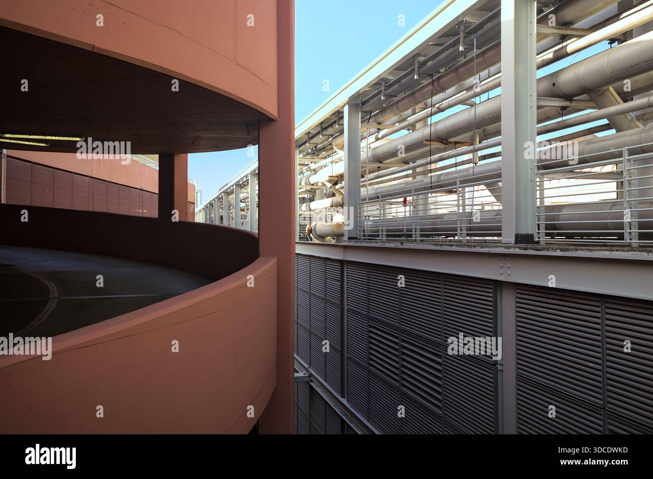 Spiral shaped ramp of a parking lot next to another building seen from ...