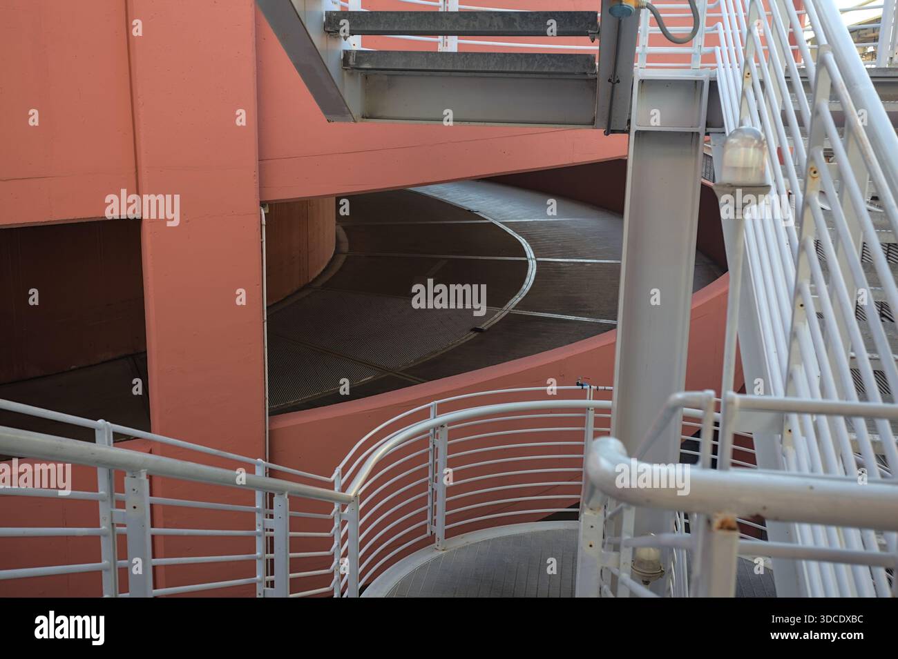 Spiral shaped ramp of a parking lot next to another building seen from ...