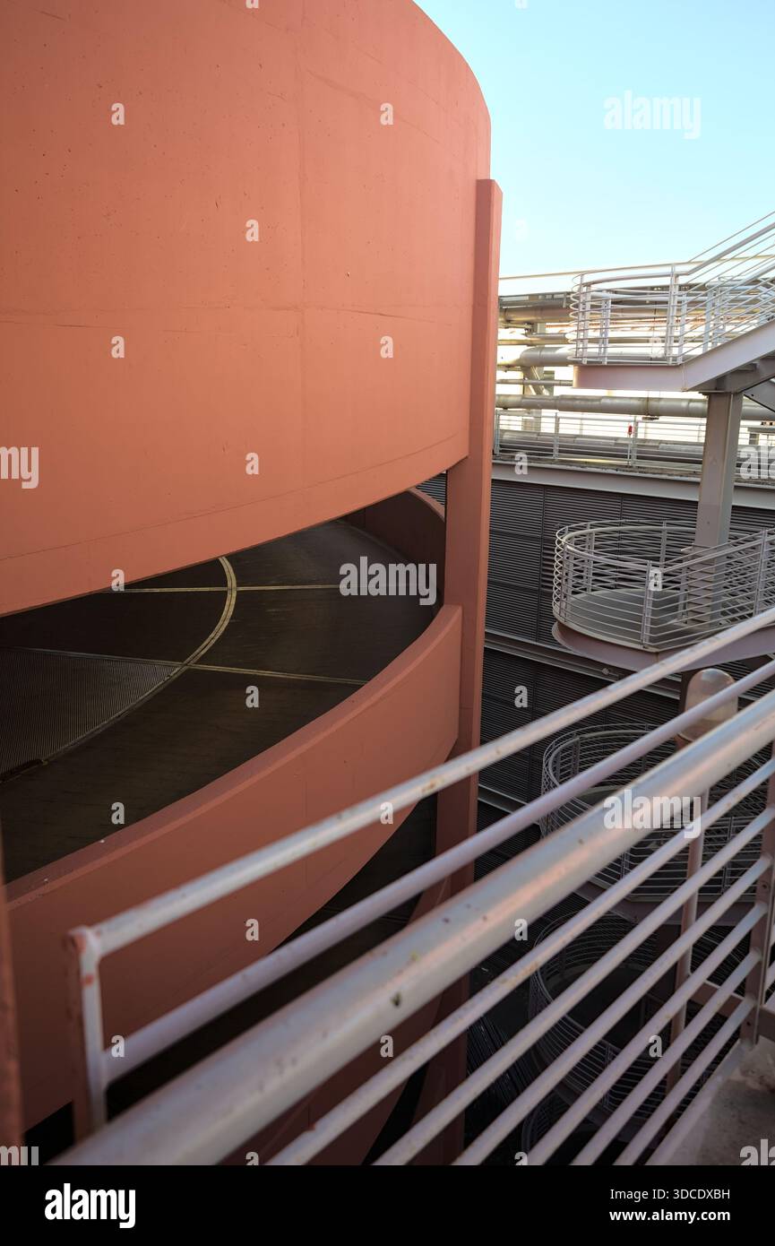Spiral shaped ramp of a parking lot next to another building seen from ...