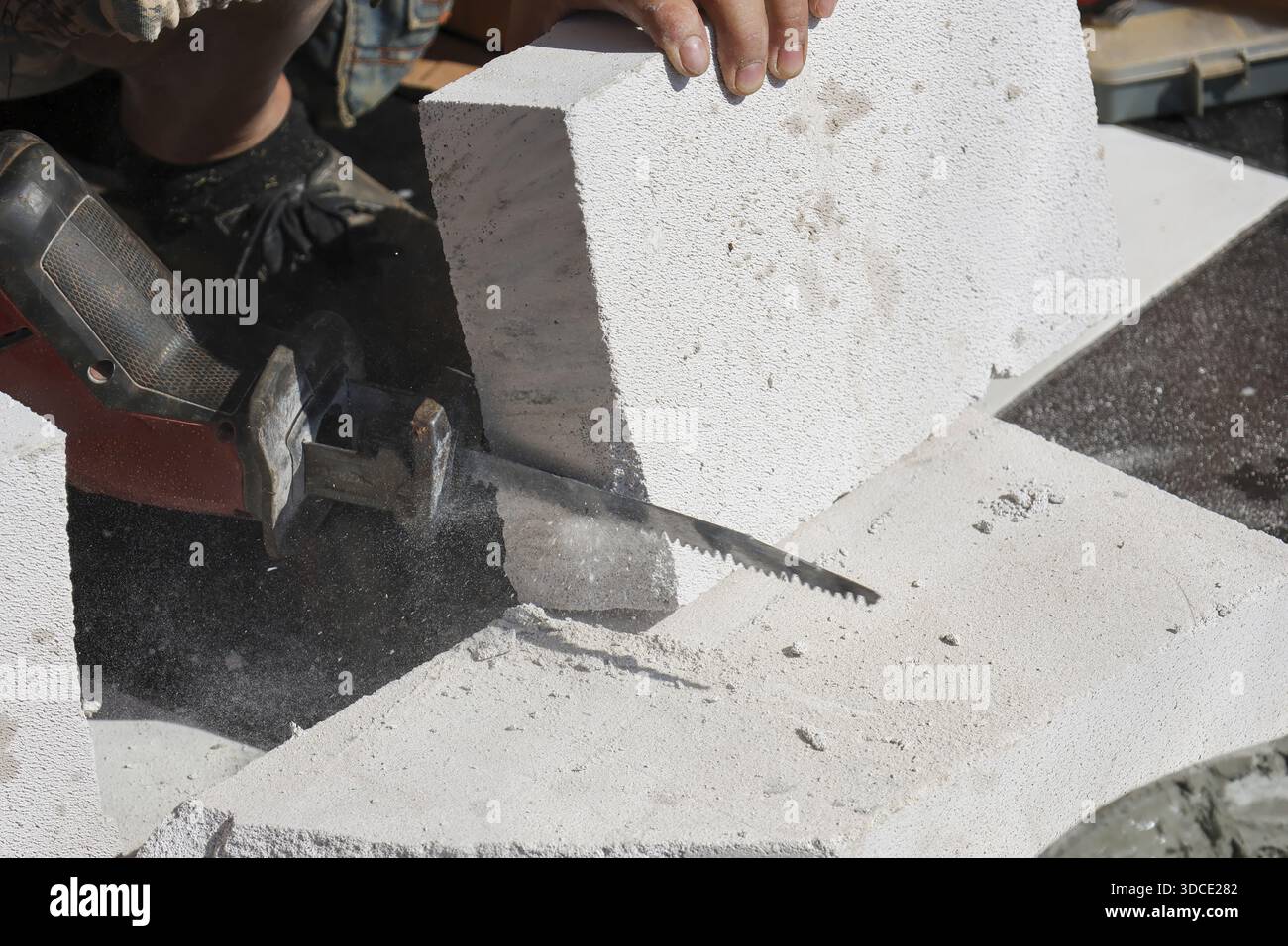 Cutting aerated block electric saw hi-res stock photography and images ...