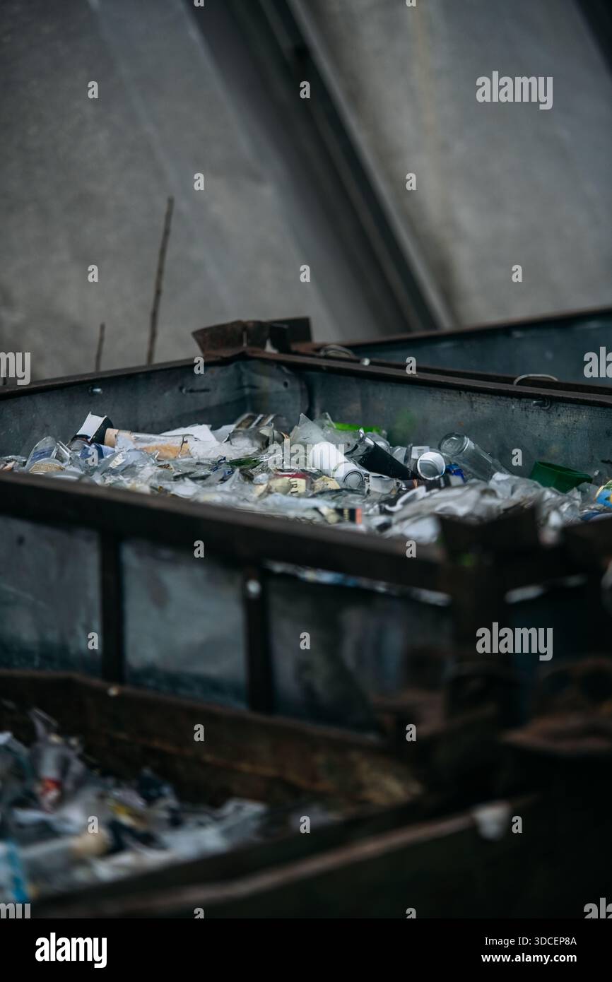Glass Waste in Metal Container Stock Photo