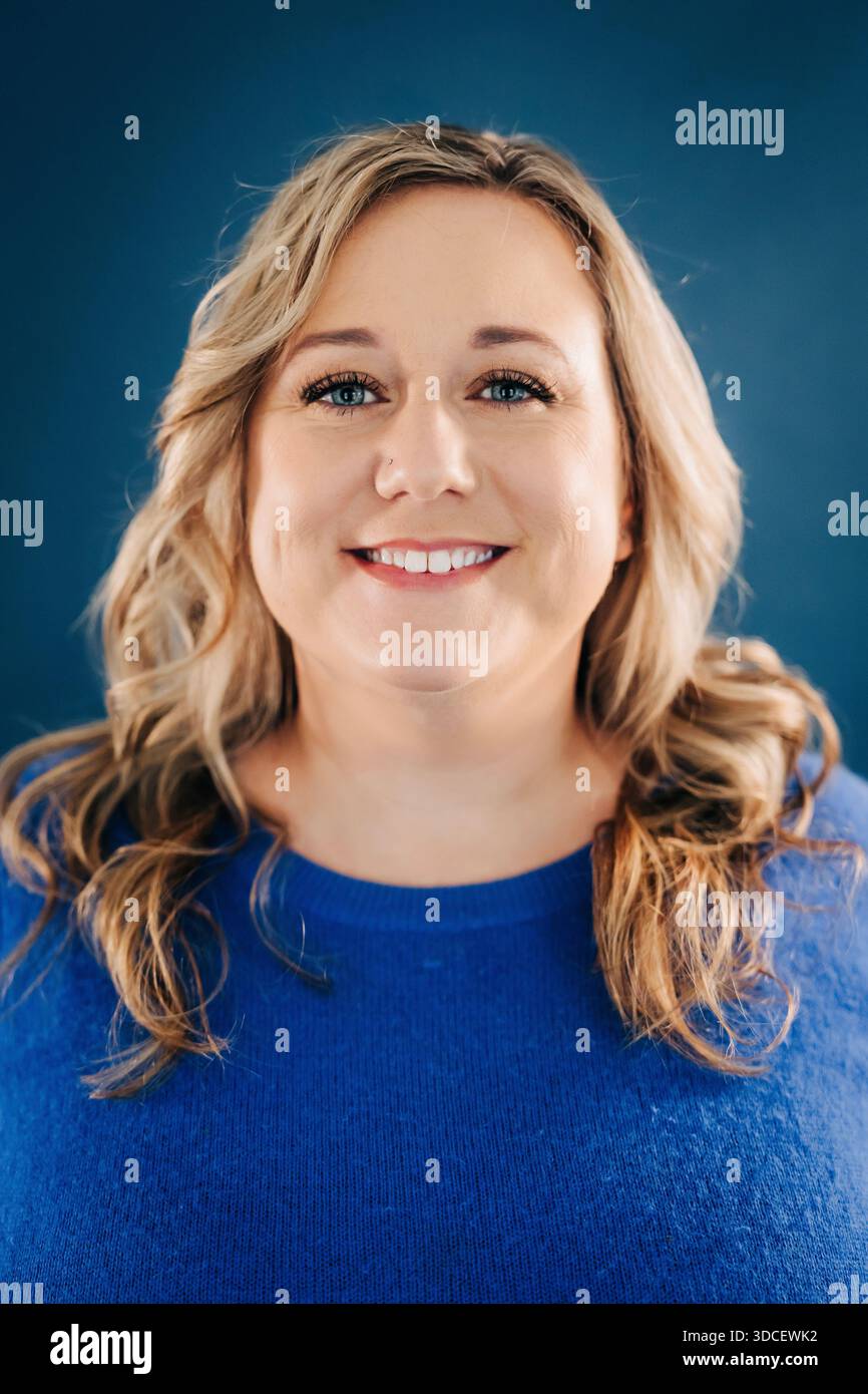 Woman in light blue sweater hi-res stock photography and images - Alamy