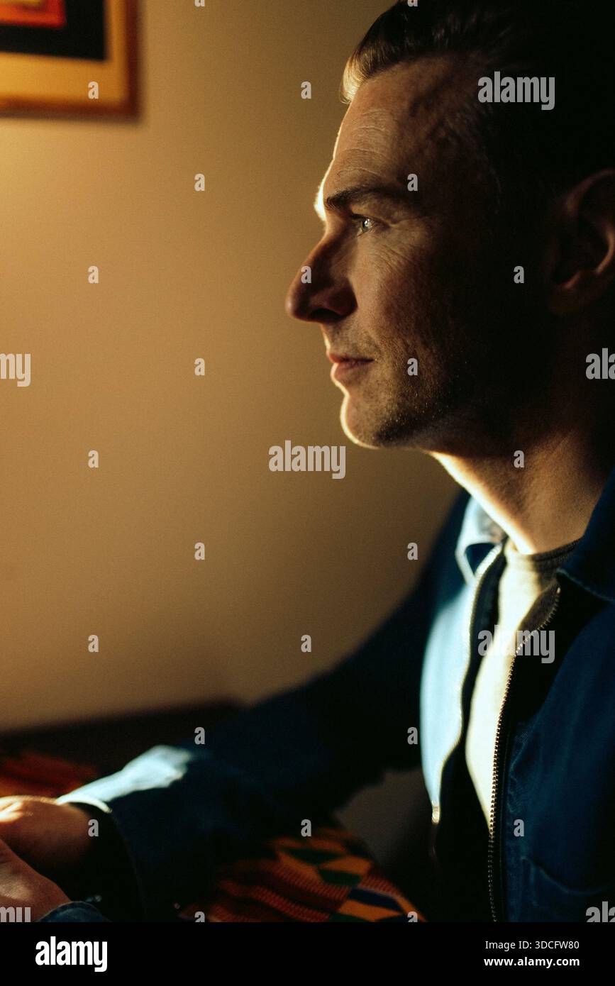 Thoughtful mature man contemplating at restaurant Stock Photo
