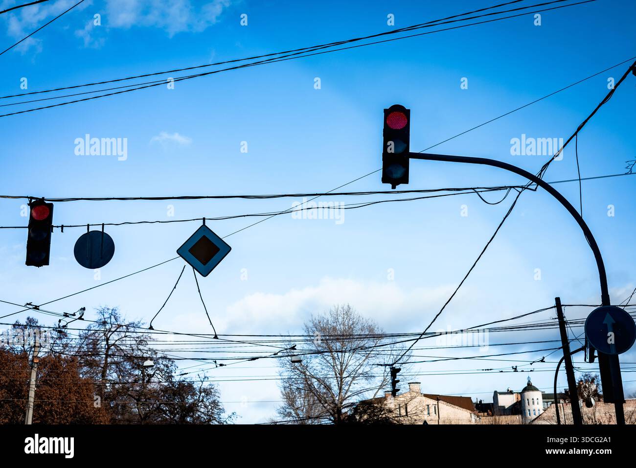 Urban infrastructure view. Overloaded overhead power lines, traffic ...