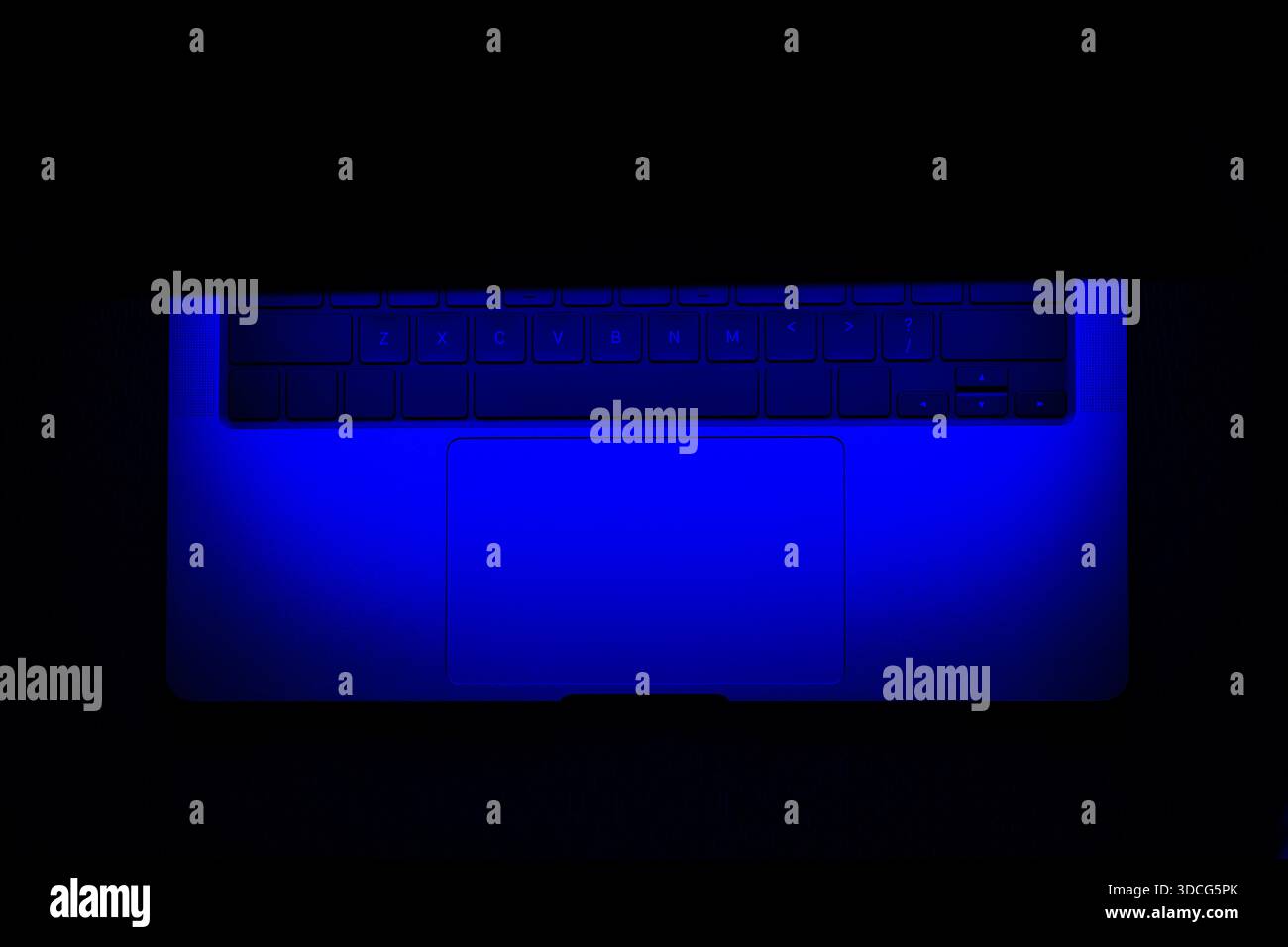 Open Glowing Blue Neon Light Modern Laptop Mockup in three-quarters in black Background, Based on a High-quality Studio shot Stock Photo
