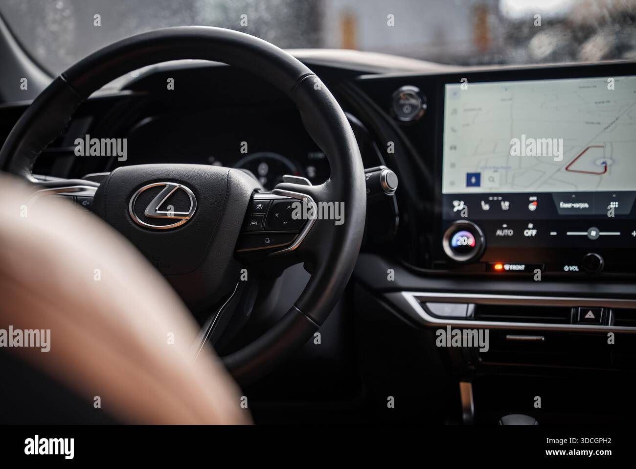 Lexus RX 450h plus interior with steering wheel and navigation map ...