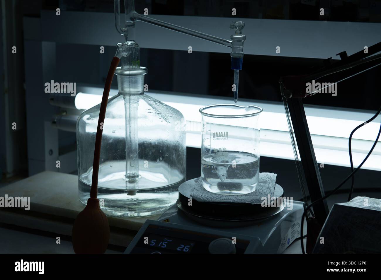Laboratory setup with glassware and liquid in a beaker Stock Photo