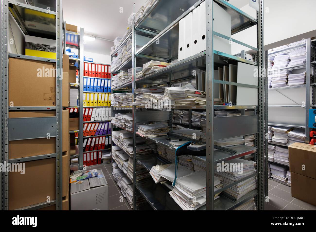 An interior view of a document archive room with metal shelving units ...