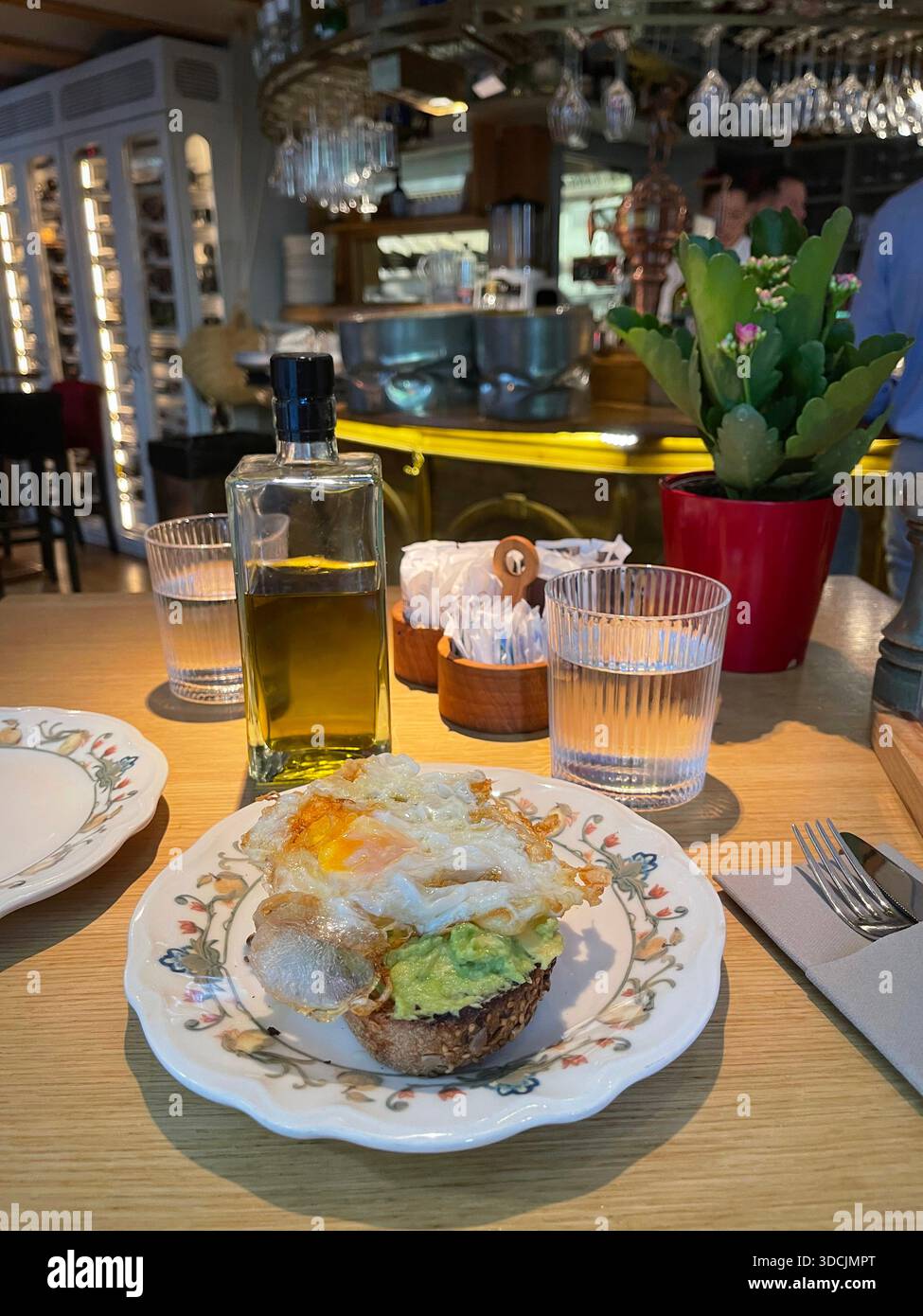 Fried egg and avocado on toast. Stock Photo