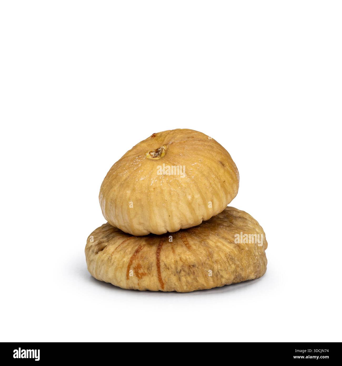 Two healthy dried figs, isolated on a plain white background Stock Photo