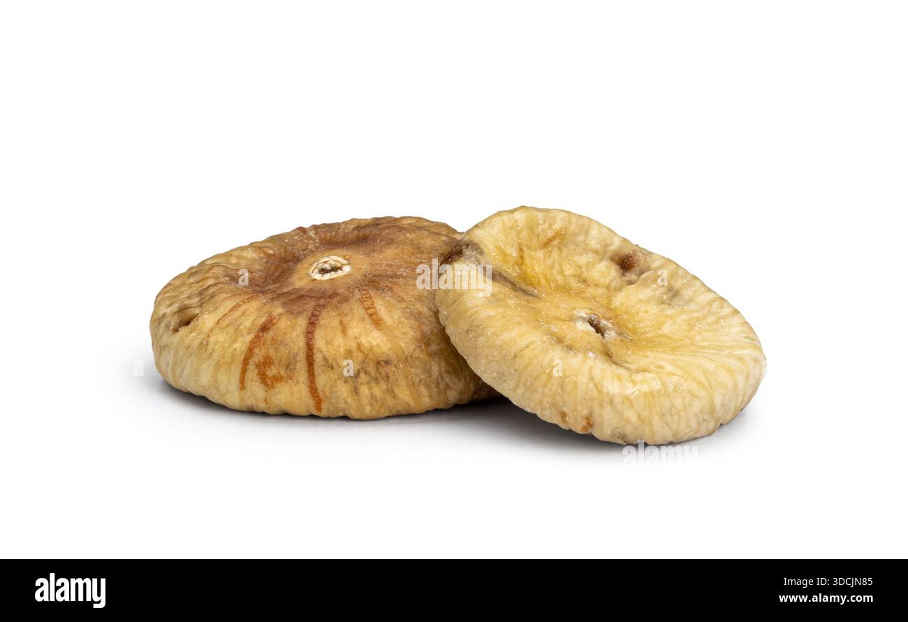 Two healthy dried figs, isolated on a plain white background Stock Photo
