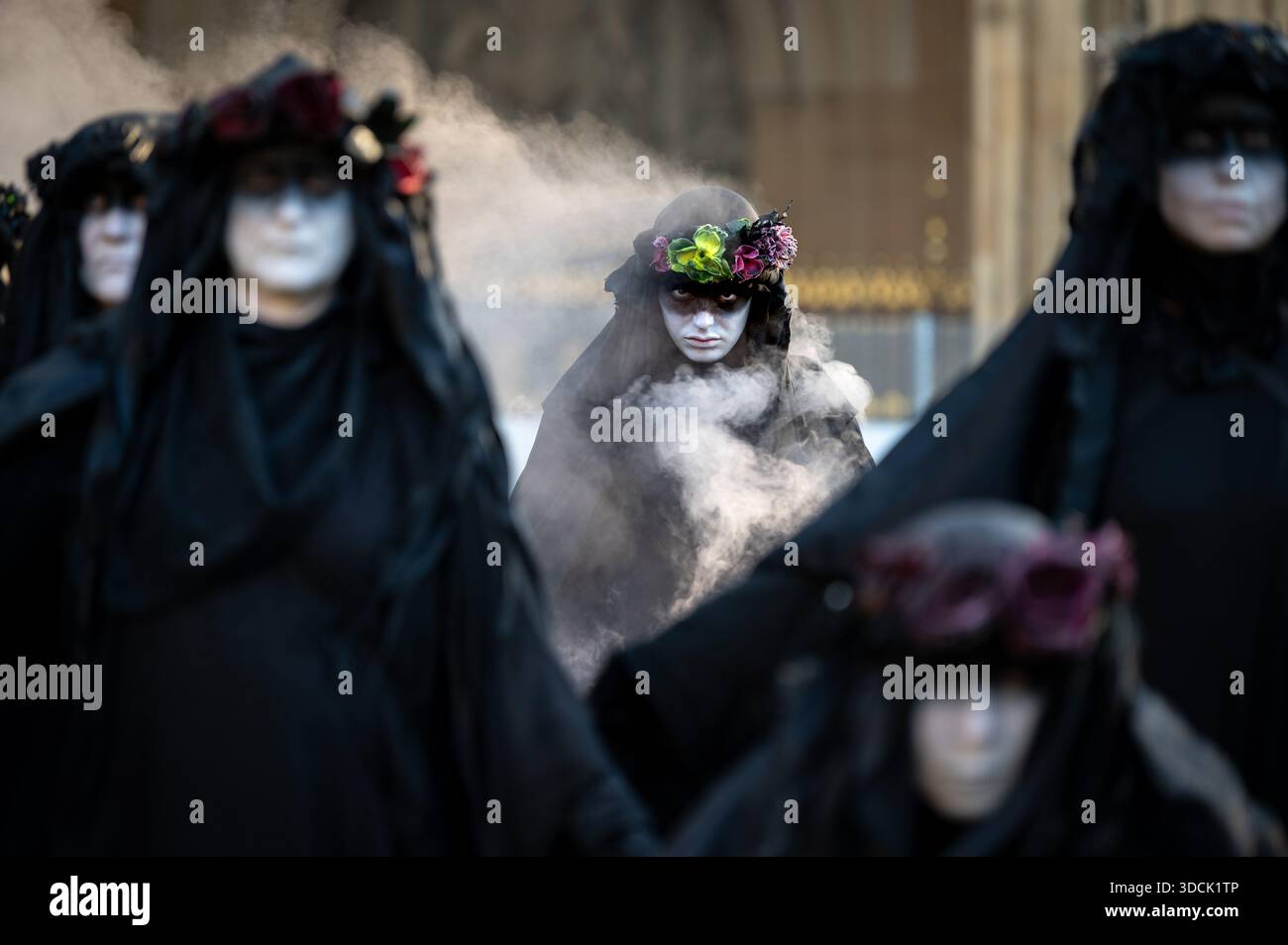 An oil slicker seen in a portrait. Extinction Rebellion Oil Slickers ...