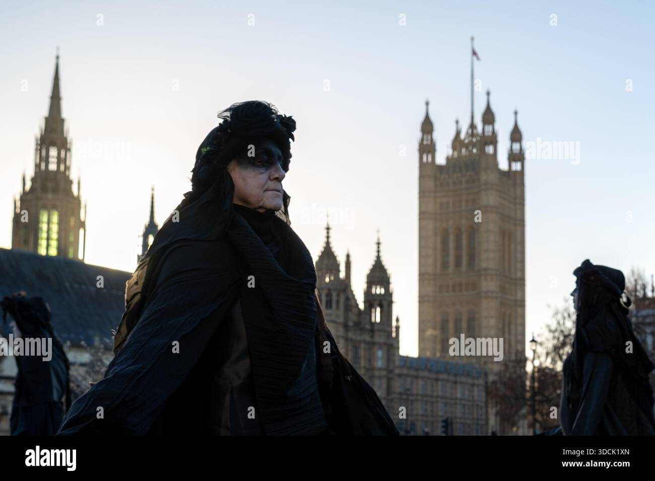 An Oil Slicker seen walking past Parliament. Extinction Rebellion Oil ...
