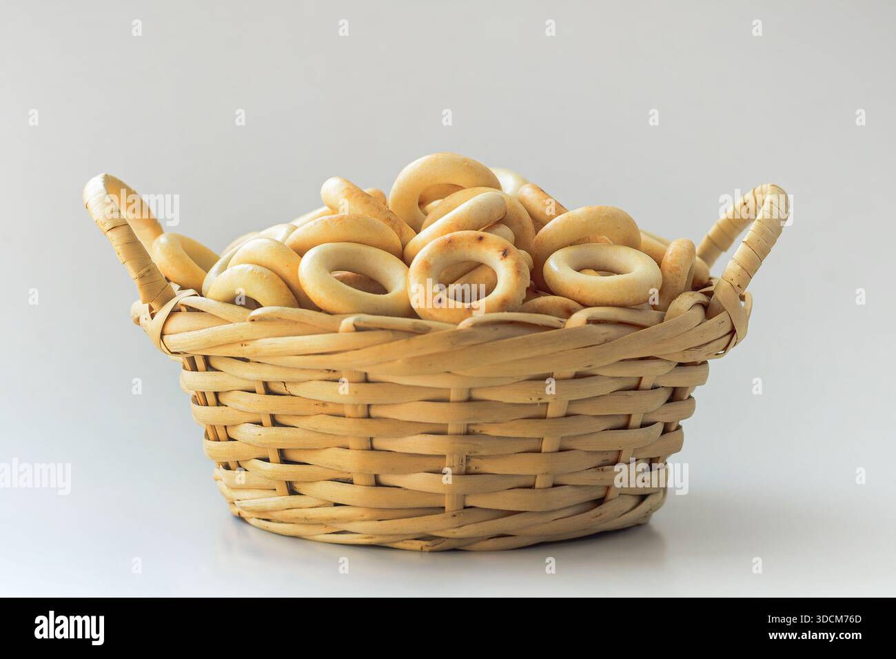 russian bread rings in wicker basket, on white Stock Photo