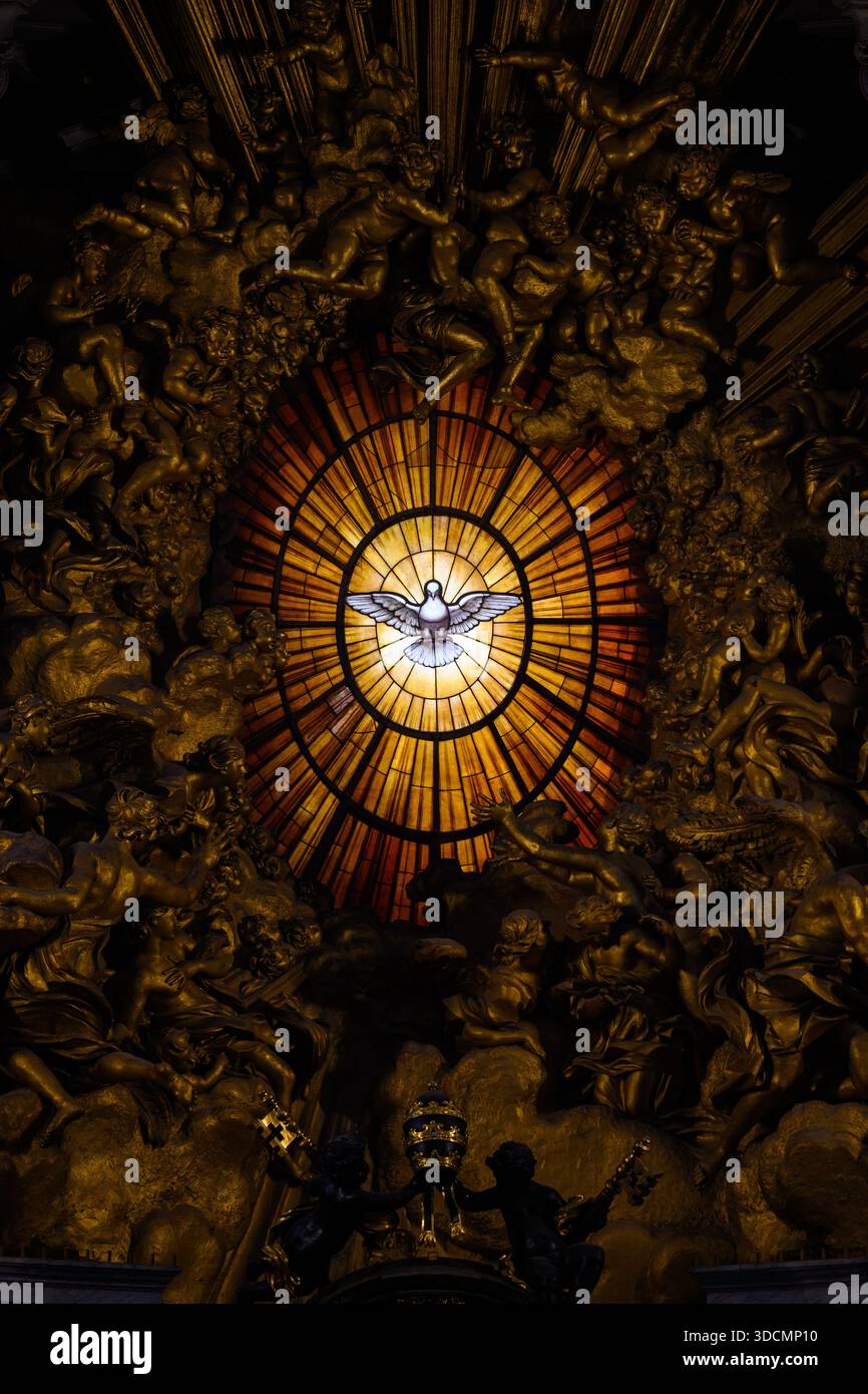 Central stained-glass window depicting the Holy Spirit in St Peter’s Basilica, Vatican, Rome, Italy. - Stock Image