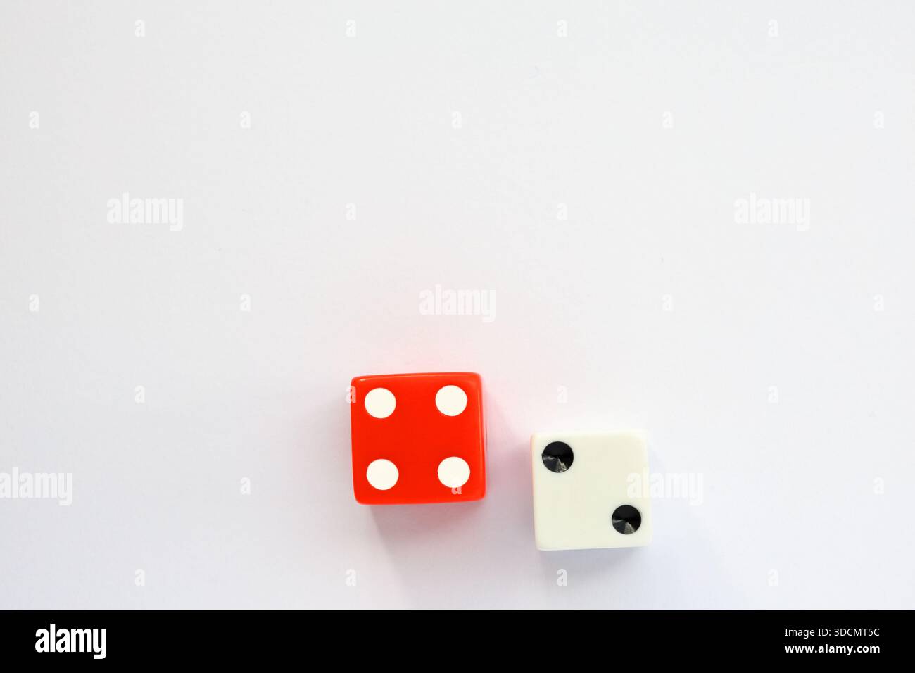 Red and white dice. Casino or luck concept. Above angle shot photography. Stock Photo
