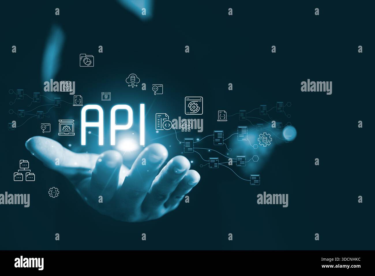 Glowing API concept floating above human hand connected digital icon representing application programming interface system integration data exchange c Stock Photo
