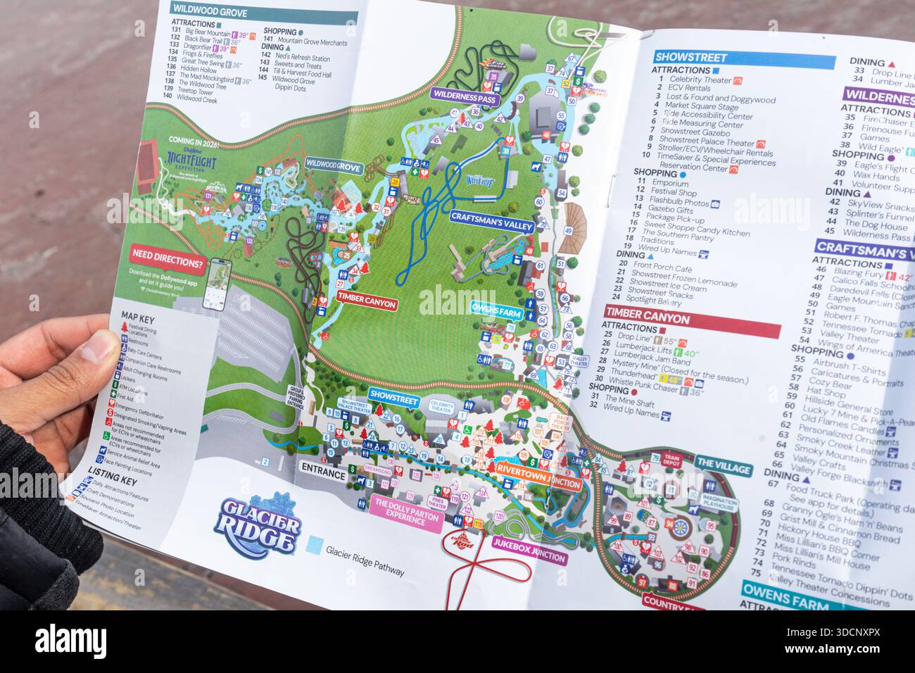 Dollywood Map.pdf Close view of a tourist holding up a map of the Dollywood theme park in ...