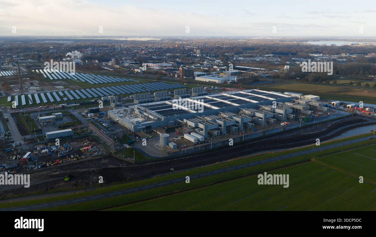 Aerial drone video of the Winschoten data center in The Netherlands, highlighting large-scale cloud computing infrastructure powered by solar energy, Stock Photo