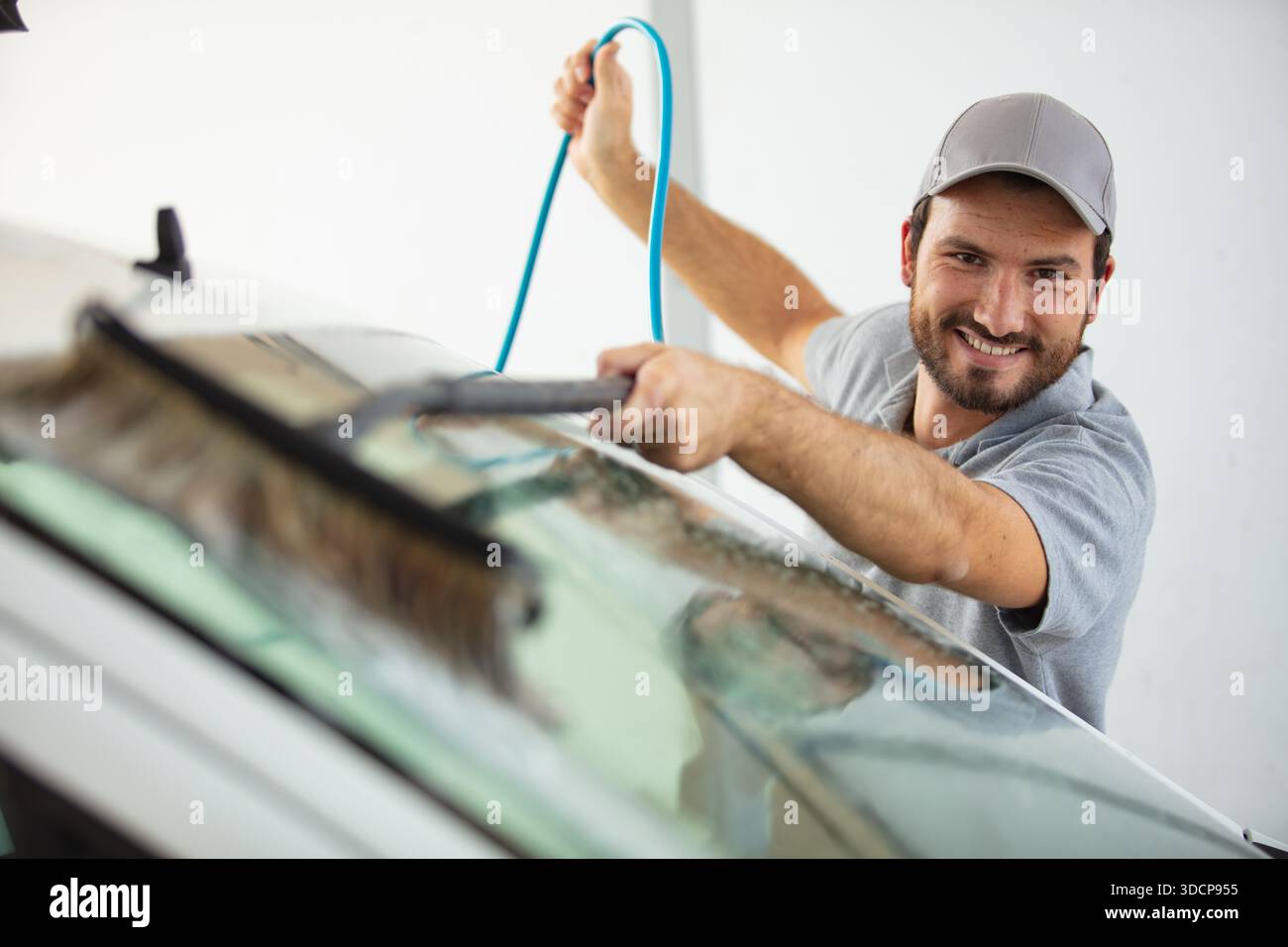 happy window cleaner on white background Stock Photo