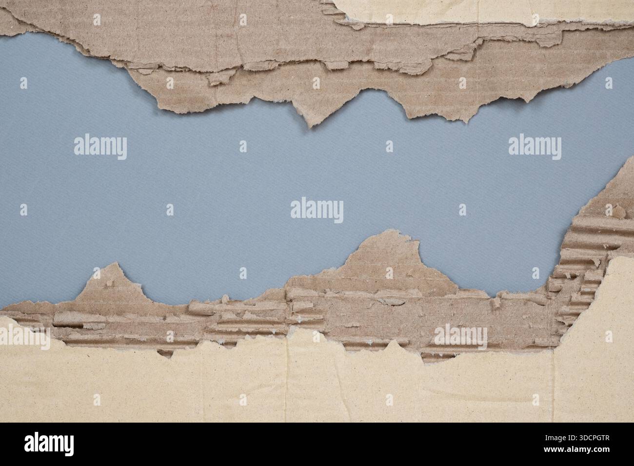 Torn Corrugated Cardboard Texture Background, Ripped Brown Kraft Paper with Peeling Layers. Stock Photo