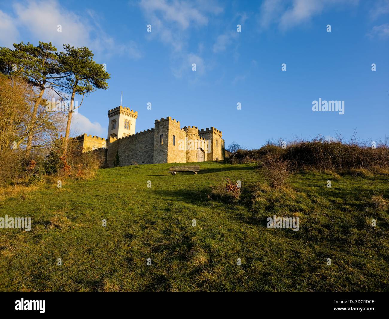 Turreted Stone Castle on Grassy Hill in Cotswolds, UK - Smartphone Captured Stock Image