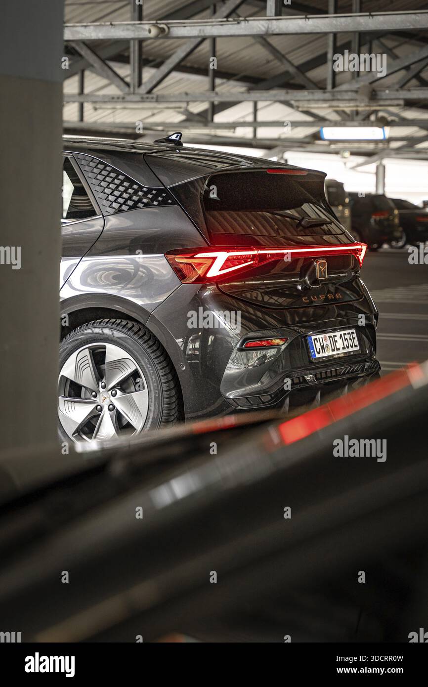 Rear view of a modern black car with distinctive LED rear lights in ...