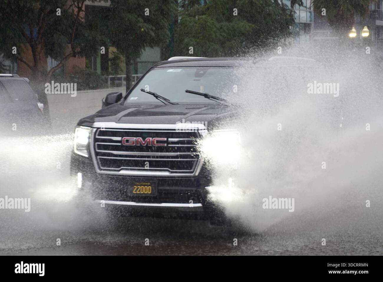 Disruption Cars Cars seen driven by a flooded street during the rainstorm . A powerful ...