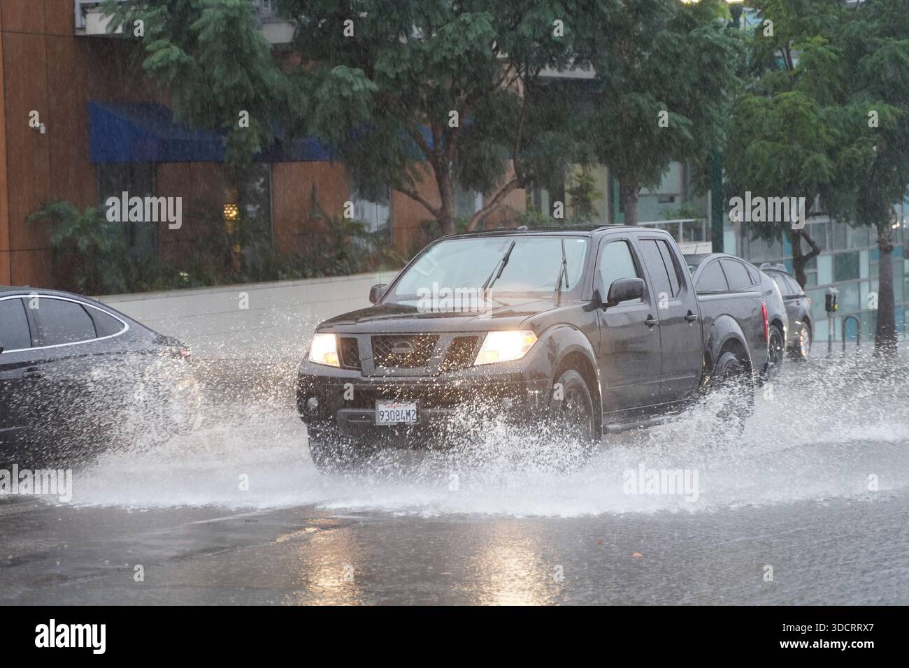 Disruption Cars Cars seen driven by a flooded street during the rainstorm . A powerful ...