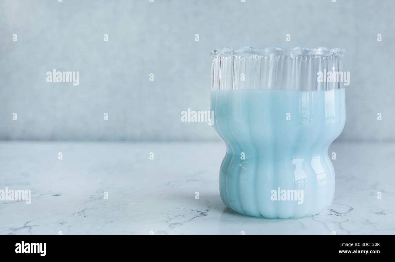 Minimalist aesthetic photograph featuring textured ribbed glass filled ...