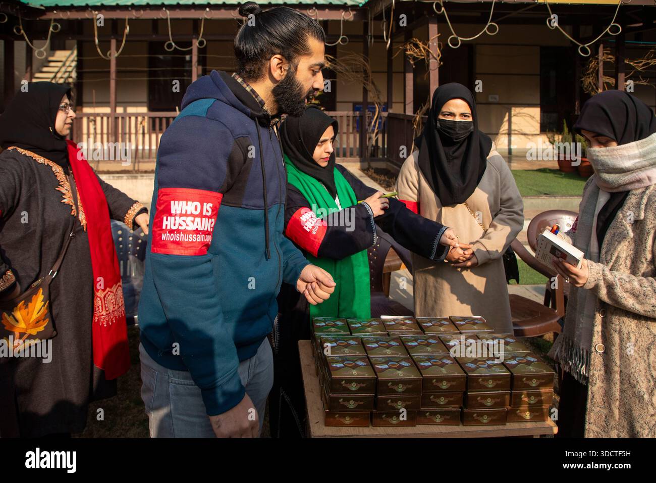 Volunteers from Who is Hussain?, a Shiite Muslim non governmental organization, distribute sweets among Christian worshippers outside the Holy Family Catholic Church during Christmas celebrations in Srinagar, Indian administered Kashmir. Advocacy groups say that Christians, a small minority in India, have in recent years documented a rise in incidents of violence, harassment and interruptions to religious gatherings, often carried out by far?right Hindu nationalist groups and local mobs, developments that have intensified debate over religious freedom and the rights of minority communities. Stock Photo